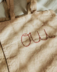 Hand embroidered, plant dyed tote bag: Oui